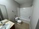 Clean bathroom with shower/tub combo, single vanity, and tile flooring at 2649 Andros Ln, Kissimmee, FL 34747