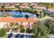 Aerial view of townhome community; property located near lake at 3083 Yellow Lantana Ln, Kissimmee, FL 34747