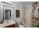 Bathroom with tub shower combination, toilet and vanity at 3083 Yellow Lantana Ln, Kissimmee, FL 34747