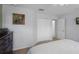 Bedroom with a queen-size bed and double doors leading to another room at 3083 Yellow Lantana Ln, Kissimmee, FL 34747