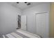 Guest bedroom with a view of the staircase and double door closet at 3083 Yellow Lantana Ln, Kissimmee, FL 34747