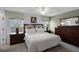 Spacious bedroom with a king-size bed, dresser, and nightstands at 3083 Yellow Lantana Ln, Kissimmee, FL 34747