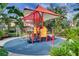 Shaded playground with play equipment at 3083 Yellow Lantana Ln, Kissimmee, FL 34747