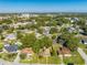 Aerial view of a single Gathering home on a tree-lined street at 309 Poinciana Cir, Kissimmee, FL 34744
