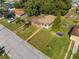 Aerial view showing a single-Gathering home with a yard at 309 Poinciana Cir, Kissimmee, FL 34744