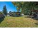 Spacious backyard with tree and playset at 309 Poinciana Cir, Kissimmee, FL 34744