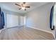 Bright bedroom with double door closet and wood-look flooring at 309 Poinciana Cir, Kissimmee, FL 34744