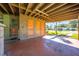 Covered carport with storage and backyard view at 309 Poinciana Cir, Kissimmee, FL 34744