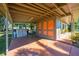 Covered carport with extra storage space at 309 Poinciana Cir, Kissimmee, FL 34744