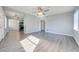 Open living room with wood-look flooring and lots of natural light at 309 Poinciana Cir, Kissimmee, FL 34744