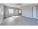 Spacious living room featuring wood-look flooring and ceiling fan at 309 Poinciana Cir, Kissimmee, FL 34744