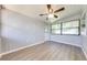 Sunroom features wood-look floors and ceiling fan at 309 Poinciana Cir, Kissimmee, FL 34744