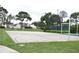 Outdoor basketball court with surrounding green space at 3218 Candle Ridge Dr # 103, Orlando, FL 32822