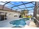 Relaxing pool area with screened enclosure and lounge chair at 342 Cassia Dr, Davenport, FL 33897