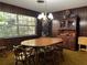 Spacious dining room boasts wood-paneled walls and large windows at 3800 Lavender Way, Casselberry, FL 32707