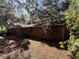 Side view of brick house with tree coverage at 3800 Lavender Way, Casselberry, FL 32707