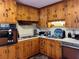 Retro kitchen with wood cabinets and appliances at 3800 Lavender Way, Casselberry, FL 32707