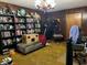 Home office with bookshelves, a gaming chair, and a large desk at 3800 Lavender Way, Casselberry, FL 32707