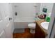 Bathroom with white bathtub, toilet, and granite vanity at 413 Sierra Mike Blvd, Lake Alfred, FL 33850