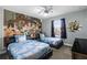 bedroom with twin beds and Toy Story mural at 4297 Paragraph Dr, Kissimmee, FL 34746