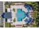 Community pool with lounge chairs and cabana at 4297 Paragraph Dr, Kissimmee, FL 34746
