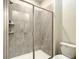 Bathroom with a large shower stall and gray tile at 4633 Target Blvd, Kissimmee, FL 34746