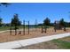 Community playground with play equipment and a pond view at 4633 Target Blvd, Kissimmee, FL 34746