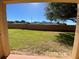 View of the grassy backyard and surrounding neighborhood at 467 La Mirage St, Davenport, FL 33897