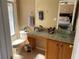 Bathroom with granite countertop and glass sink at 467 La Mirage St, Davenport, FL 33897