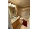 Bathroom with granite vanity, glass sink, and bathtub at 467 La Mirage St, Davenport, FL 33897