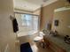 Bathroom with tub, shower, and granite vanity at 467 La Mirage St, Davenport, FL 33897