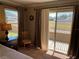 Bedroom with balcony access and ample natural light at 467 La Mirage St, Davenport, FL 33897