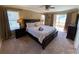 Spacious bedroom with king-size bed and access to balcony at 467 La Mirage St, Davenport, FL 33897