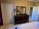 Main bedroom with a large dresser and mirror at 467 La Mirage St, Davenport, FL 33897