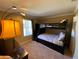 Bunk beds in a well-lit bedroom with neutral carpeting at 467 La Mirage St, Davenport, FL 33897