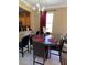 Dining room with a round table and six chairs at 467 La Mirage St, Davenport, FL 33897