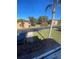 Partial view of a residential neighborhood with palm trees at 467 La Mirage St, Davenport, FL 33897