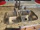 Stainless steel double sink with granite countertop at 467 La Mirage St, Davenport, FL 33897