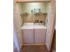 Well-lit laundry room with washer and dryer at 467 La Mirage St, Davenport, FL 33897