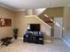 Living room with TV and entertainment center at 467 La Mirage St, Davenport, FL 33897