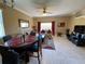 Open living and dining area with tile flooring at 467 La Mirage St, Davenport, FL 33897