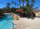 Freeform pool with rock features and lounge chairs at 467 La Mirage St, Davenport, FL 33897
