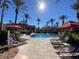 Relaxing pool area with lounge chairs and palm trees at 467 La Mirage St, Davenport, FL 33897
