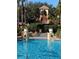 Inviting resort-style pool with water features and lush landscaping at 467 La Mirage St, Davenport, FL 33897