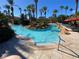 Freeform swimming pool with rock features and stairs at 467 La Mirage St, Davenport, FL 33897