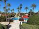 Inviting resort-style pool with lounge chairs and umbrellas at 467 La Mirage St, Davenport, FL 33897
