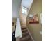 Bright staircase with a large window at 467 La Mirage St, Davenport, FL 33897
