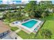 Community pool with lounge chairs at 5660 Minute Man Ct, Orlando, FL 32821