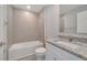 Small bathroom with granite countertop and shower/tub combo at 652 Mesilla Dr, Kissimmee, FL 34758