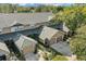 Aerial view of townhouses with attached garages and lush landscaping at 679 Scarlet Oak Cir # 113, Altamonte Springs, FL 32701